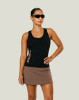 Model wearing Cuera Oncourt Slim Tank Top & Oncourt Cuera Skirt 2-in-1, front studio view