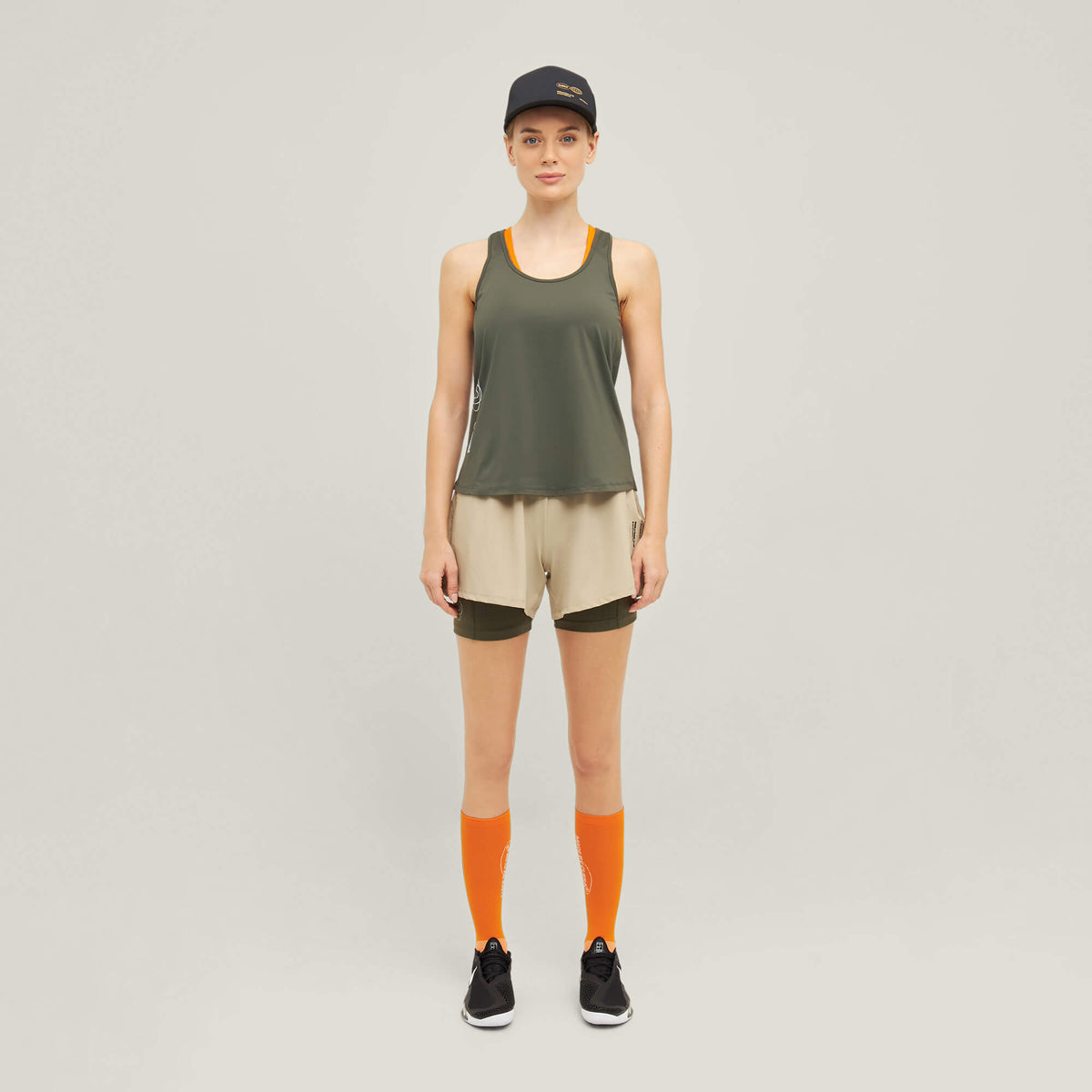 Model wearing Cuera Oncourt WPC Tank in Army, front studio view